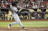Detroit Tigers' Javier Báez hits an RBI double against the Arizona Diamondbacks during the seventh inning of a baseball game Saturday, May 18, 2024, in Phoenix. (AP Photo/Ross D. Franklin)