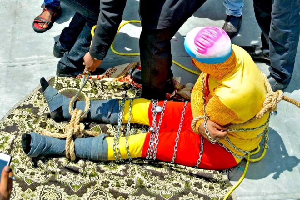 An Indian magician who disappeared after being lowered into a river while shackled has drowned, police confirmed.Chanchal Lahiri was trying to recreate Harry Houdini’s famous escapist feat but did not emerge from into the River Hooghly, a distributary of the Ganges in West Bengal state.The magician was meant to break free and swim to the surface when he attempted the trick on Sunday.His body washed up around 1km from the site and was identified late on Monday.Mr Lahiri, also known as Jadugar Mandrake, was tied up with six locks, chains and rope before he was dropped into the river from a boat.He told reporters before the event: “The magic we are going to do today is so risky."First my hands will be tied behind my back with a rope. My legs will also be bound by a thick rope.“My whole body will be in chains. There will be six locks.”People gathered on two boats, and several people lined the shore and the landmark Howrah Bridge in Kolkata to watch the display. The crowd started to panic after Mr Lahiri did not appear after more than 10 minutes, the Press Trust of India has reported.Police and a team of divers then began their search.Jayanta Shaw, a photographer with a local newspaper who witnessed Mr Lahiri attempting the trick, said he spoke to the magician beforehand.“I asked him why he risked his life for magic,” Mr Shaw told the BBC. “He smiled and said, ‘If I do it right, it’s magic. If I make a mistake, it becomes tragic.”The magician told him that he wanted to do this trick in order "to revive interest in magic".This is not the first time Mr Lahiri has attempted a risky underwater trick .He was lowered into the same river inside a glass box more than 20 years ago, but had managed to escape to safety.Mr Shaw also witnessed Mr Lahiri's previous underwater trick. He said: "I never thought he would not come out of the water this time.”Mr Lahiri had sought permission from the Kolkata Police and Kolkata Port Trust before performing his trick, according to Press Trust of India,However, he did not tell them the trick would have a "connection with water", police have said."He had mentioned the act was to happen in a boat or vessel... hence we allowed him permission. He vaguely mentioned an 'extra act' which we did not clarify," said a police officer who was not identified. "We are investigating."