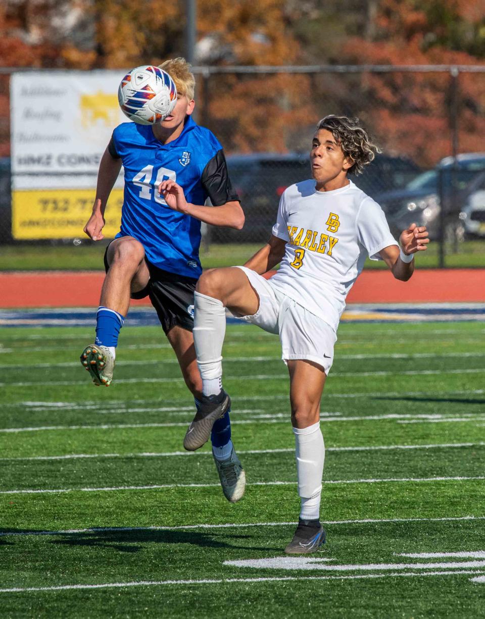 Shore Maxx Eichenbaum and David Brearley's Luiggi Cedeno battle for the ball at the boys' soccer Shore Regional vs Brearley in NJSIAA Group 1 championship game.