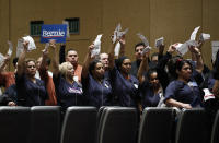 Casino workers hold up presidential preference cards as they support Democratic presidential candidate Sen. Bernie Sanders, I-Vt., during a presidential caucus at the Bellagio hotel-casino, Saturday, Feb. 22, 2020, in Las Vegas. (AP Photo/John Locher)