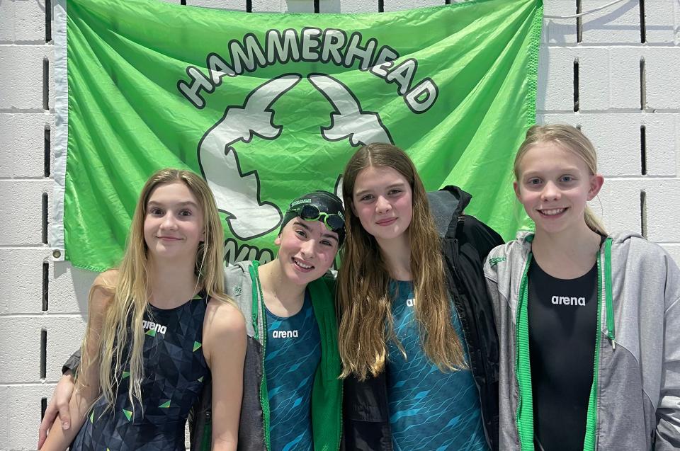 The Hammerhead relay group of (from left) Hadley Corlew, Maeve Riley, Parker Ford and Parker Edgerton gather for a photo in Holland recently when they competed in the USA Michigan Age Group States (MAGS) Championship meet.