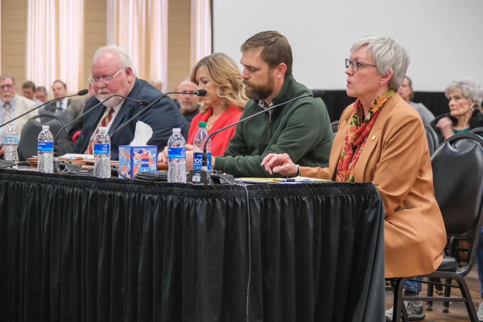 County judges from the impacted area of the Texas Panhandle, including Lisa Johnson of Hemphill County, left, Mitchell Locke of Roberts County, Cindy Irwin of Hutchinson County, and Chris Porter of Gray County, speak to the investigation committee on day two of the Panhandle Wildfires Investigative Committee hearings in Pampa.