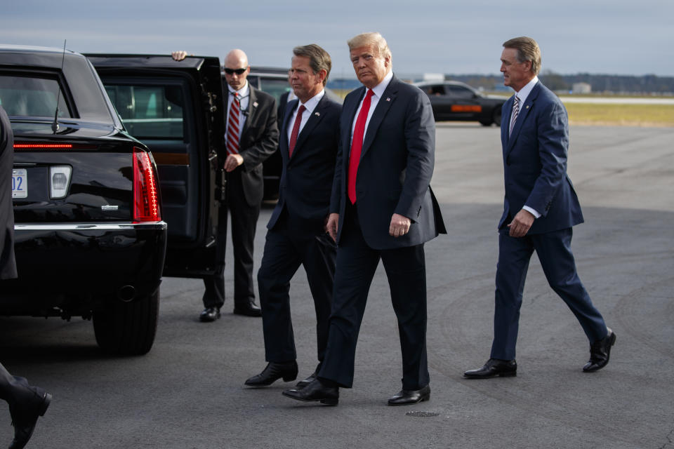 President Donald Trump arrives to speak at a campaign rally, Sunday, Nov. 4, 2018, in Macon, Ga. (AP Photo/Evan Vucci)