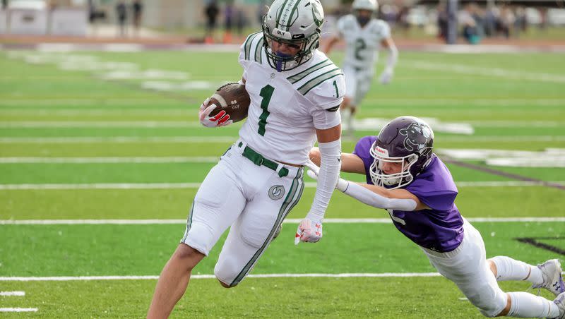 Olympus’ Luke Bryant scores a touchdown in a 5A quarterfinal high school football game against Box Elder in Brigham City on Friday, Nov. 3, 2023.