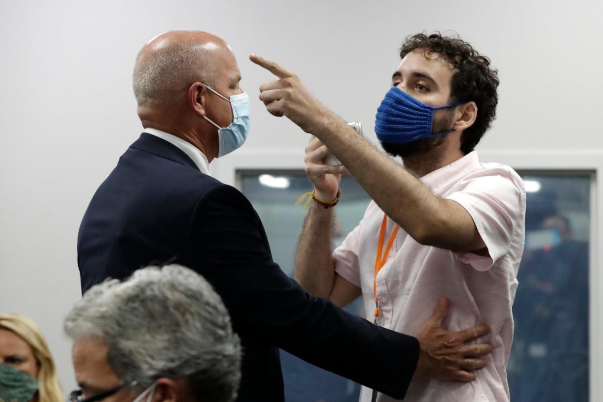 Thomas Kennedy of Florida heckles governor Ron DeSantis at a coronavirus press conference in Miami: AP