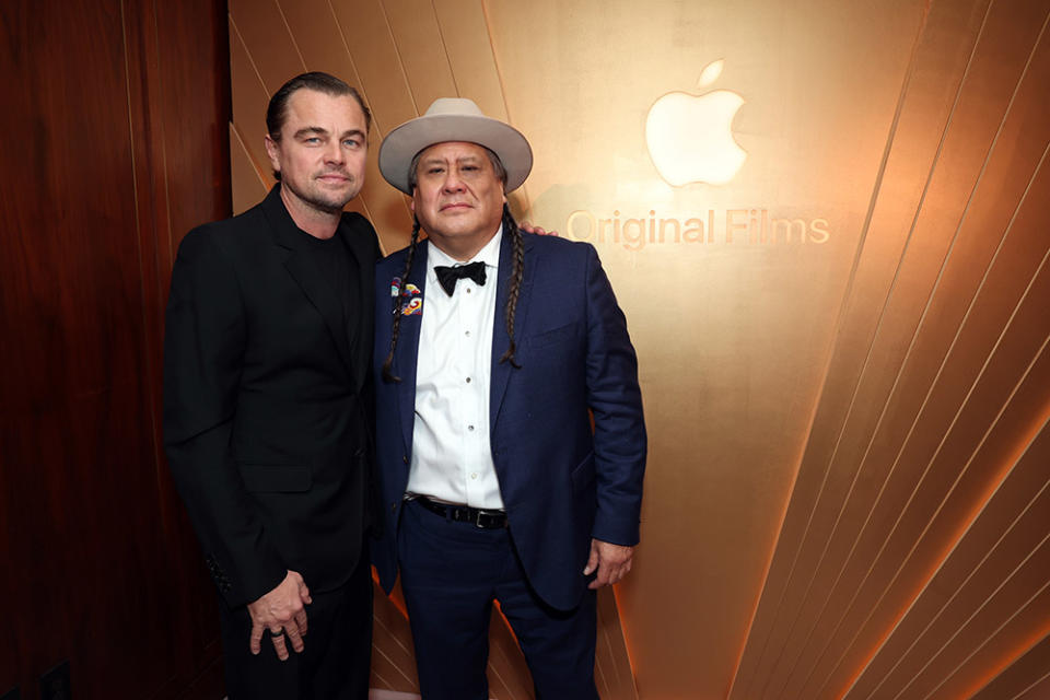 Leonardo DiCaprio (L) and Yancey Red Corn attend the Apple Original Films Oscars celebration at the Sunset Tower Hotel on March 10, 2024 in Los Angeles, California.