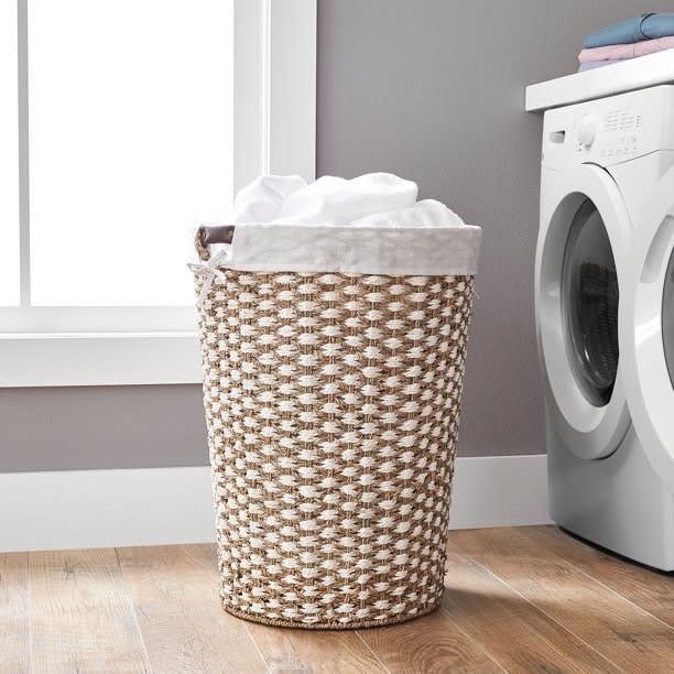 The laundry basket in front of a washer dryer set