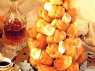 For dessert impress your guests with a Croquembouche, which is a traditional French dessert made of profiteroles filled with cream or creme patisserie. The traditional dish, which literally means 'crunch in the mouth', is stacked into a cone shape and decorated with spun sugar. View recipe