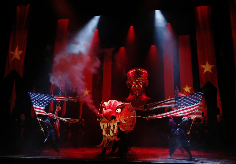 The cast performs during a photocall for a new production of "Miss Saigon" at the Prince Edward Theatre in London May 19, 2014. The production marks the 25th anniversary of the musical by Claude-Michel Schonberg and Alain Boubil. REUTERS/Luke MacGregor (BRITAIN - Tags: ENTERTAINMENT TPX IMAGES OF THE DAY)