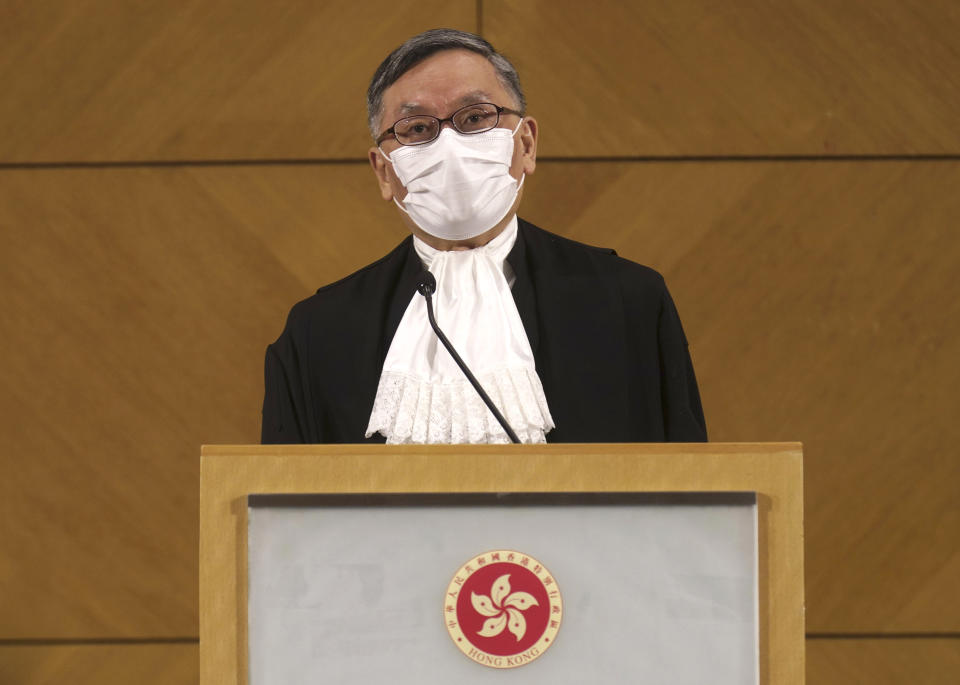 New Hong Kong Chief Justice Andrew Cheung listens to reporters questions during a press conference in Hong Kong Monday, Jan. 11, 2021. Hong Kong’s new top judge warned Monday that the semiautonomous Chinese territory’s courts need to show they are impartial amid a flurry of politically charged cases or risk losing public trust. (AP Photo/Vincent Yu)