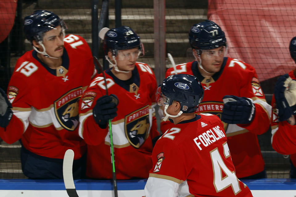 Teammates congratulate Florida Panthers defenseman Gustav Forsling (42) after he scored a goal against the Dallas Stars during the second period of an NHL hockey game, Monday, May 3, 2021, in Sunrise, Fla. (AP Photo/Joel Auerbach)