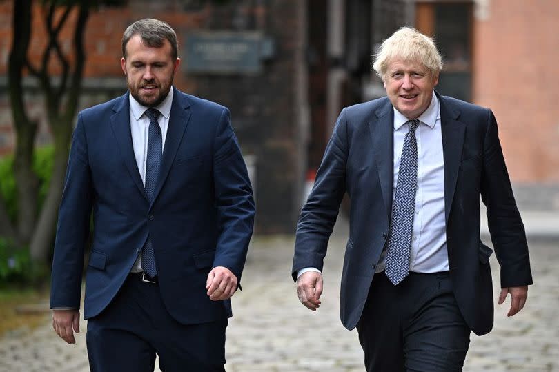 Jonathan Gullis and Boris Johnson at a Cabinet away day at Middleport Pottery in 2022 -Credit: OLI SCARFF/AFP via Getty Images