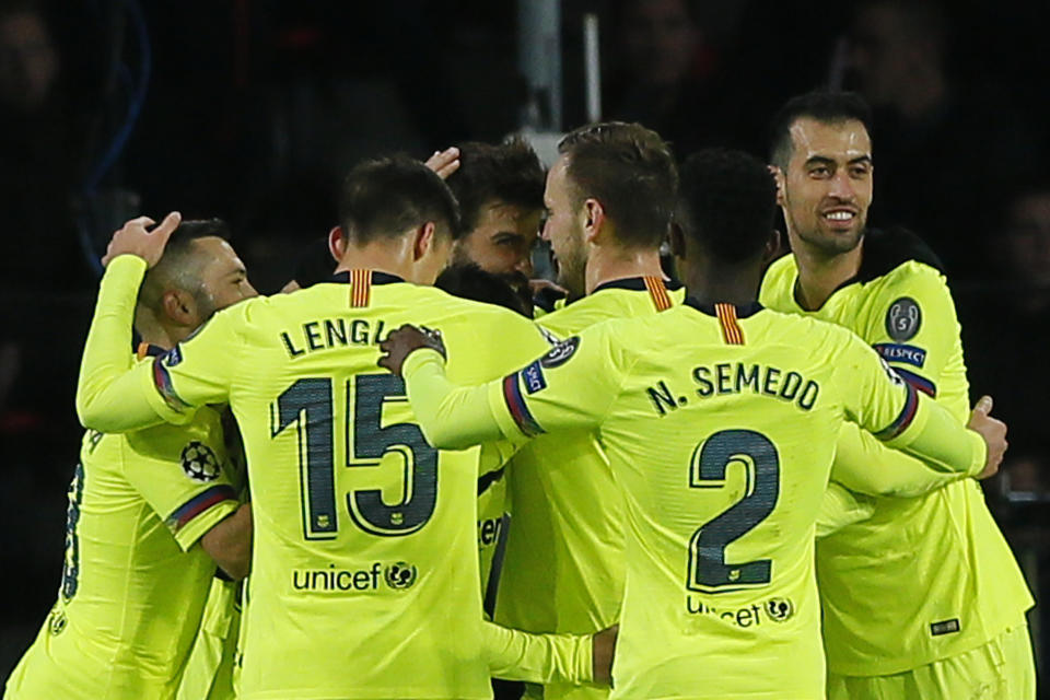 Barcelona players celebrate scoring 2-0 during a Group B Champions League soccer match between PSV Eindhoven and Barcelona at the Philips stadium in Eindhoven, Netherlands, Wednesday, Nov. 28, 2018. (AP Photo/Peter Dejong)