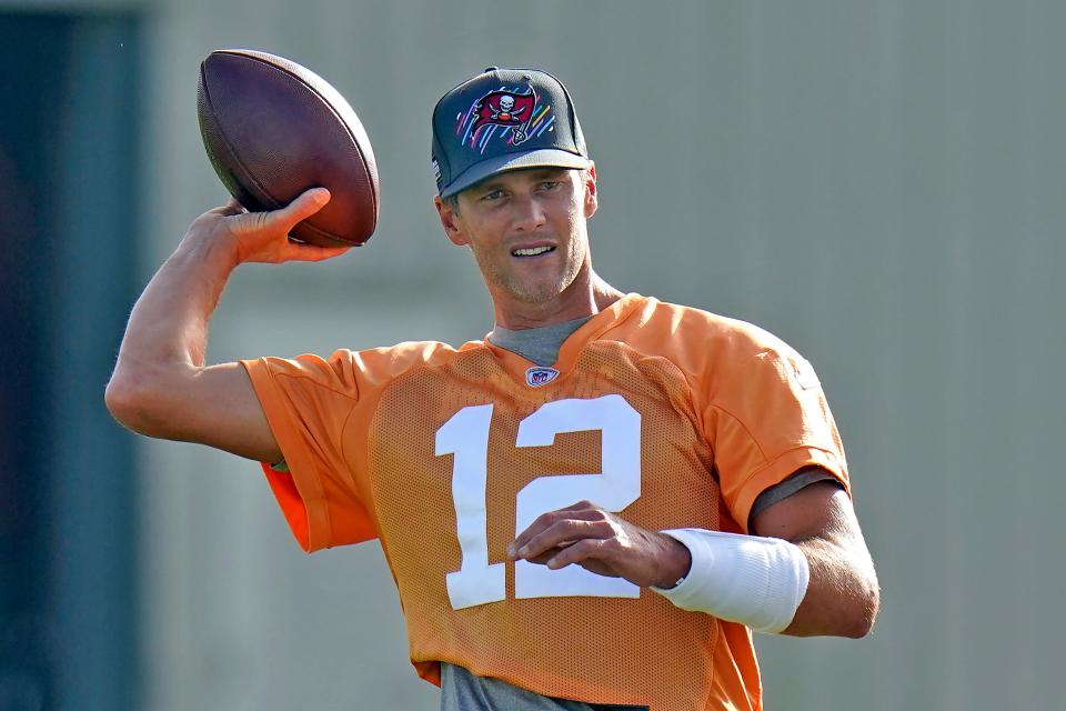 Tampa Bay Buccaneers quarterback Tom Brady throws a pass during NFL football training camp, Thursday, July 28, 2022, in Tampa, Fla.