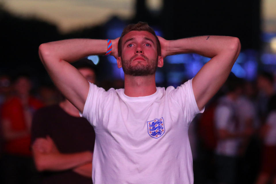 <p>England fan looks dejected after the match. REUTERS/Simon Dawson </p>