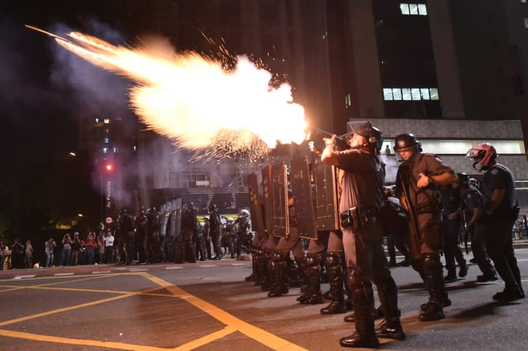 Police fire tear gas grenades at supporters of suspended Brazilian President Dilma Rousseff holding a demonstration during her impeachment trial in Sao Paulo, Brazil on August 29, 2016