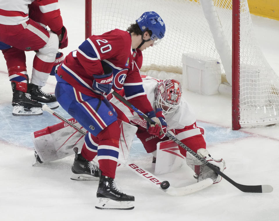 Detroit Red Wings goaltender James Reimer (47) makes a save against Montreal Canadiens' Juraj Slafkovsky (20) during the second period of an NHL hockey game Tuesday, April 16, 2024, in Montreal. (Christinne Muschi/The Canadian Press via AP)