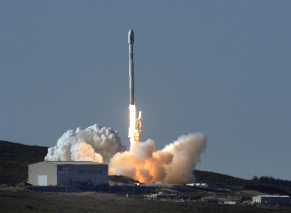 A Falcon 9 rocket carrying a small science satellite for Canada is seen as it is launched from a newly refurbished launch pad in Vandenberg Air Force Station