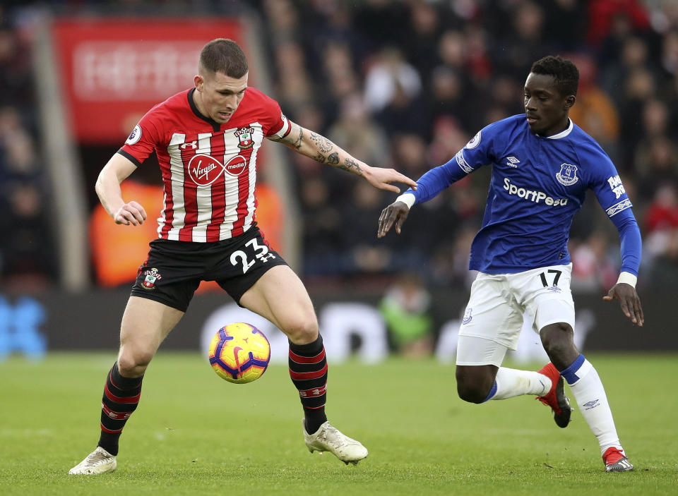 Southampton's Pierre-Emile Hojbjerg, left, vies for the ball with Everton's Idrissa Gueye during the English Premier League soccer match between Southampton and Everton at St Mary's, Southampton, England, Saturday, Jan. 19, 2019. (Adam Davy/PA via AP)