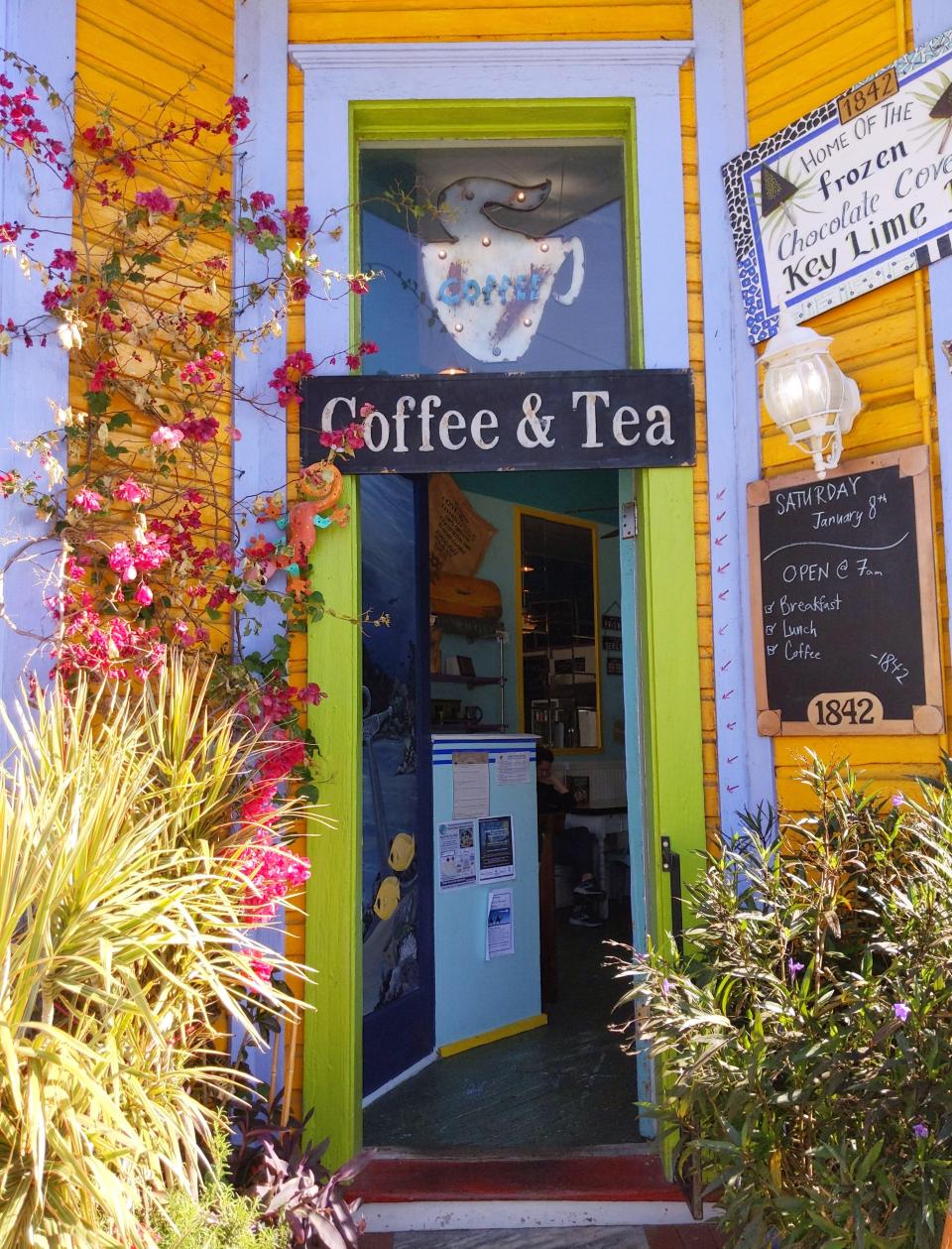 The colorful entrance of a coffee and tea shop.