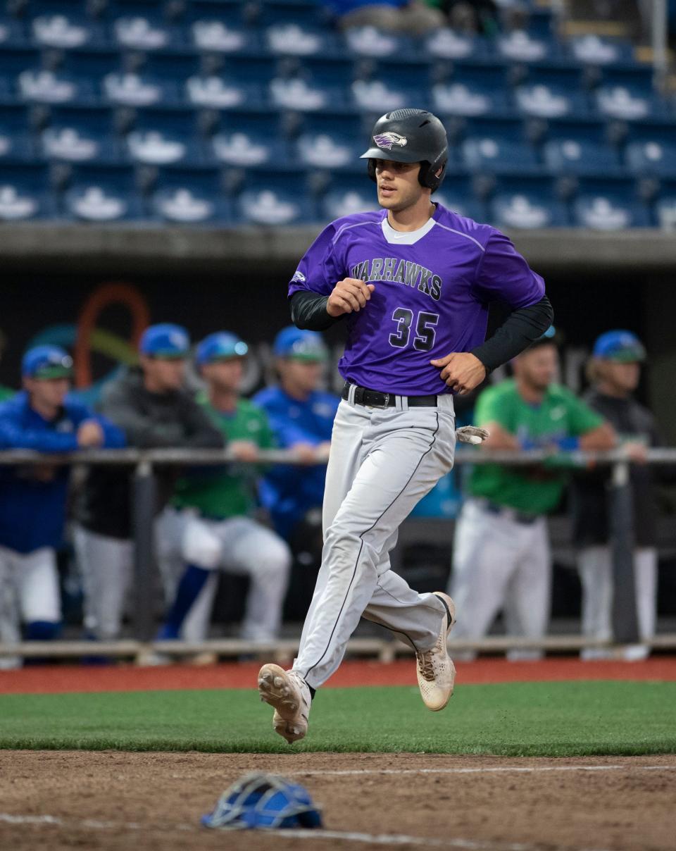 Nick Paget (35) scores to give the Warhawks a 3-0 lead during the University of West Florida vs. University of Wisconsin–Whitewater baseball game at Blue Wahoos Stadium in Pensacola on Wednesday, March 23, 2022.