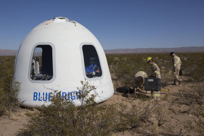 FILE - This Tuesday, Dec. 12, 2017 photo provided by Blue Origin shows the New Shepard Crew Capsule 2.0 after landing in west Texas during a test. Named after the first American in space, Alan Shepard, the spacecraft made a 10-minute suborbital flight. An instrumented test dummy was aboard, named Mannequin Skywalker. (Blue Origin via AP)