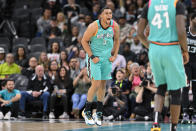 San Antonio Spurs' Keldon Johnson (3) celebrates after a basket during the second half of an NBA basketball game against the Memphis Grizzlies, Friday, March 17, 2023, in San Antonio. (AP Photo/Darren Abate)