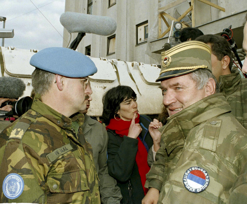 FILE - In this April 9, 1994 file photo, former Bosnian Serb commander Ratko Mladic, right, leaves the UN headquarters at Sarajevo airport after talks with the UN General, Sir Michael Rose and Bosnian Commander Rasim Delic. U.N. judges will on Tuesday, June 8, 2021 deliver their final ruling on the conviction of former Bosnian Serb army chief Ratko Mladic on charges of genocide, war crimes and crimes against humanity during Bosnia's 1992-95 ethnic carnage. (AP Photo/Enric Marti, File)