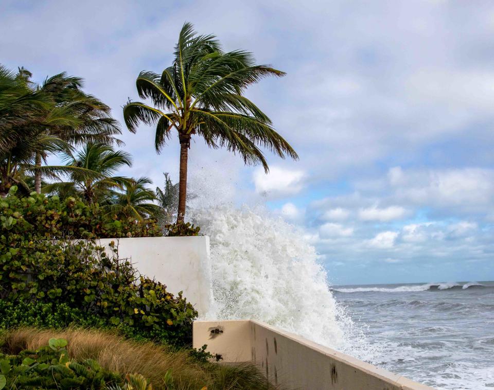 Massive waves pound against the seawall just east North Ocean Boulevard and Bahama Lane on Thursday.