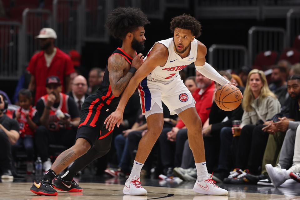 Pistons guard Cade Cunningham is defended by Bulls guard Coby White during the first half on Tuesday, Feb. 27, 2024, in Chicago.