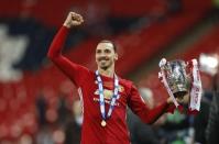 Britain Soccer Football - Southampton v Manchester United - EFL Cup Final - Wembley Stadium - 26/2/17 Manchester United's Zlatan Ibrahimovic celebrates with the trophy Reuters / Darren Staples Livepic