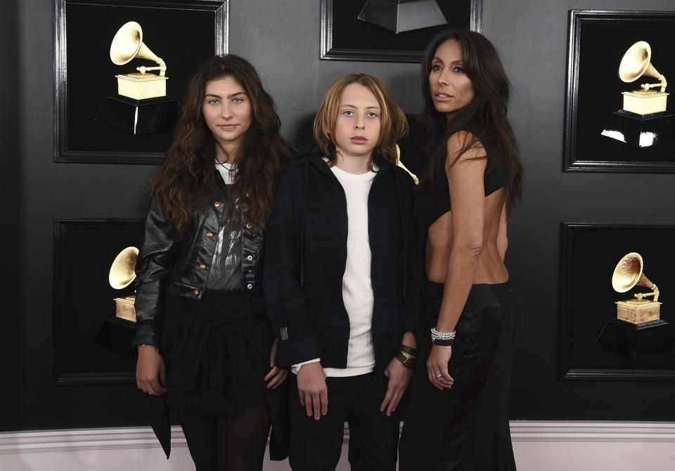 Toni Cornell, from left, Christopher Nicholas Cornell, and Vicky Karayiannis arrive at the 61st annual Grammy Awards at the Staples Center on Sunday, Feb. 10, 2019, in Los Angeles. (Photo by Jordan Strauss/Invision/AP)