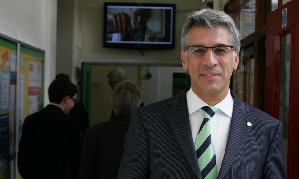 Steve Chalke in a school corridor.