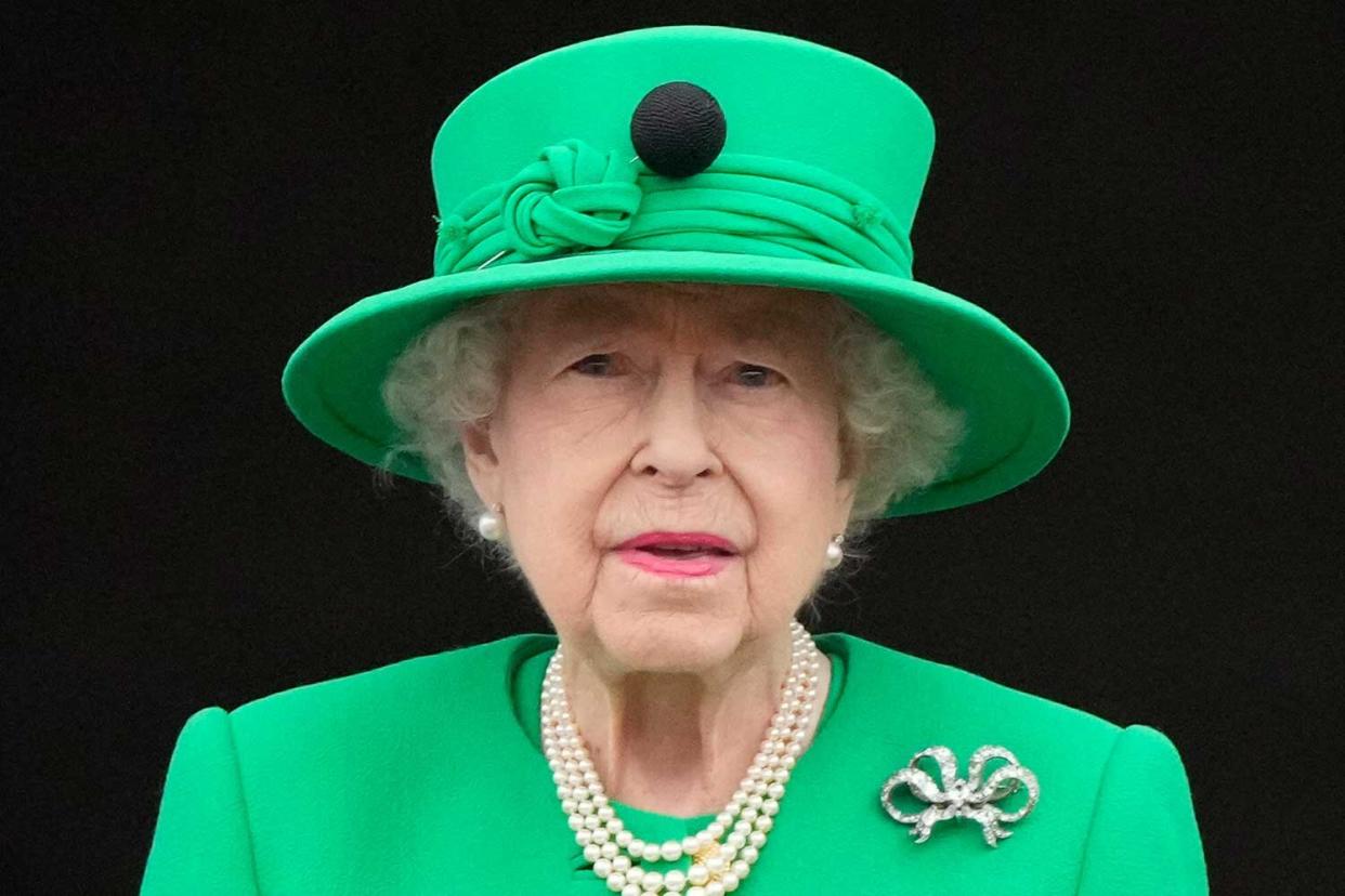 Queen Elizabeth II stands on the balcony during on June 05, 2022 in London, England. The Platinum Jubilee of Elizabeth II is being celebrated from June 2 to June 5, 2022, in the UK and Commonwealth to mark the 70th anniversary of the accession of Queen Elizabeth II on 6 February 1952.