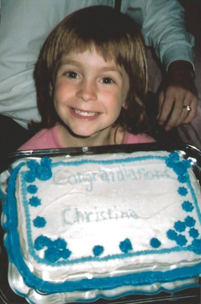 Christina Tosi as a child, holding a cake