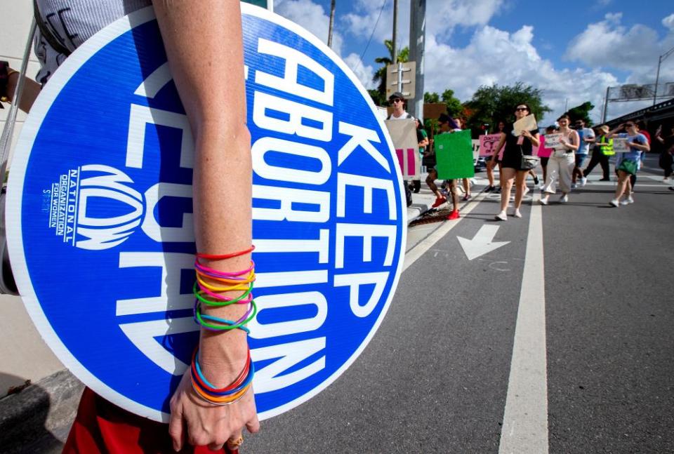 Abortion rights activists protest in downtown Miami, Florida, on 9 July 2022.