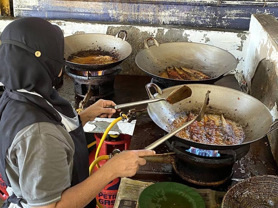 The fish is only fried from noon onwards in large woks filled with oil