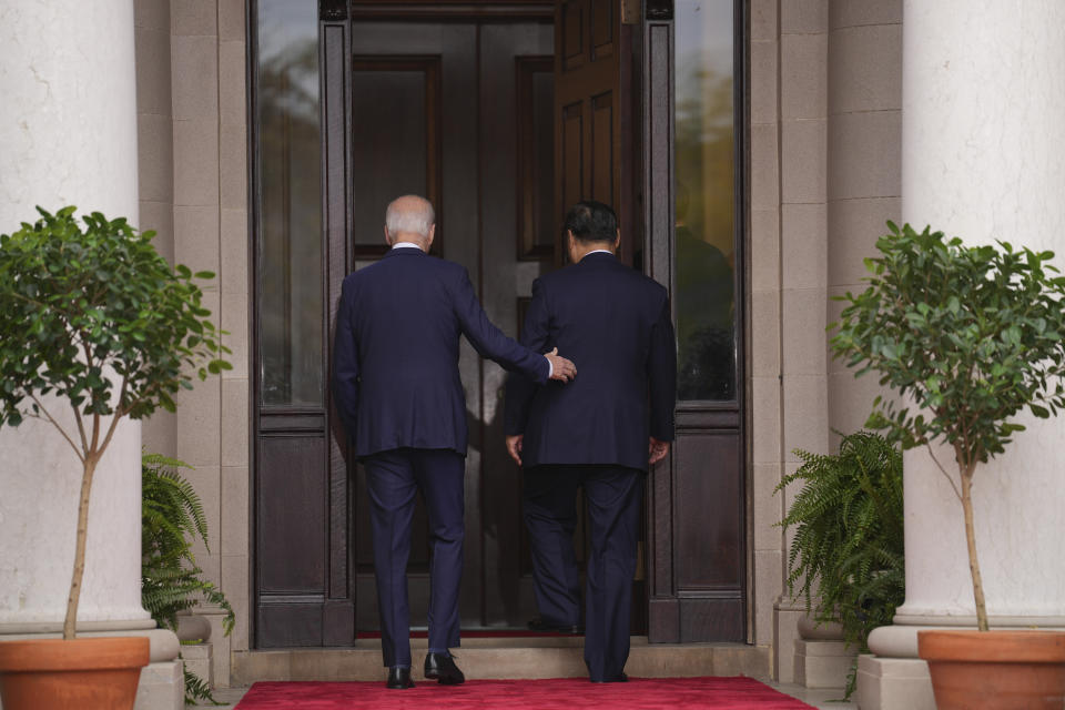 President Joe Biden walks with China's President President Xi Jinping at the Filoli Estate in Woodside, Calif., Wednesday, Nov, 15, 2023, on the sidelines of the Asia-Pacific Economic Cooperative conference. (Doug Mills/The New York Times via AP, Pool)