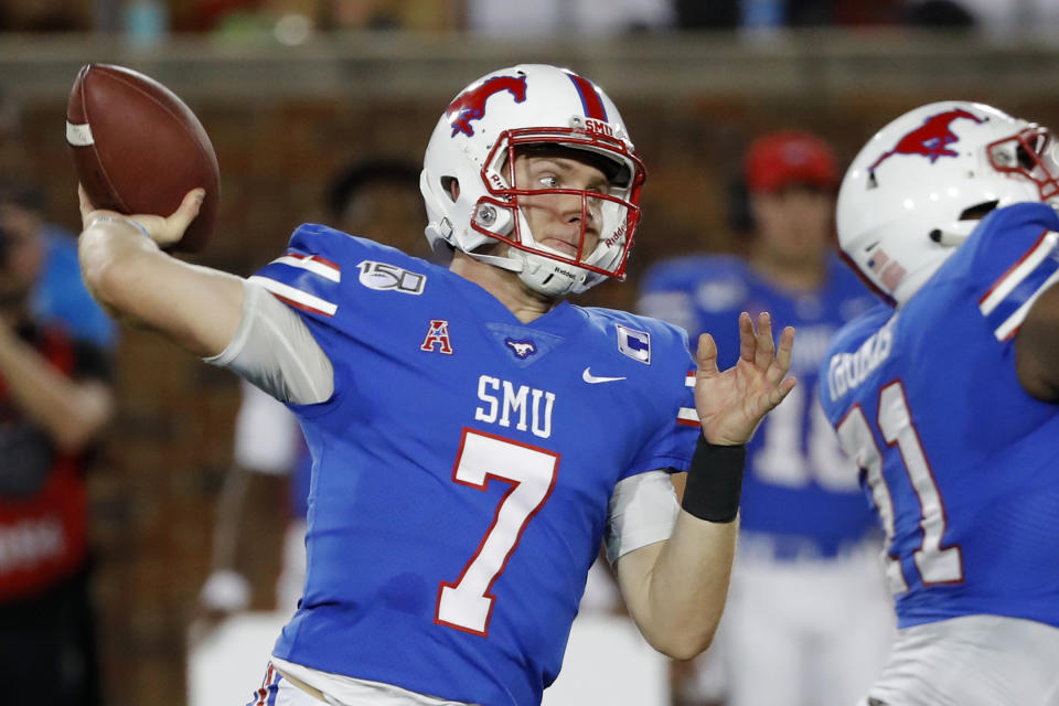 FILE - In this Oct. 5, 2019, file photo, SMU quarterback Shane Buechele throws a pass during the first half of an NCAA college football game against Tulsa, in Dallas, Texas. Buechele is the starting quarterback for an undefeated Top 25 team, like so many people envisioned when he started 12 games as a true freshman for Texas. Except Buechele is now close to home after going to No. 19 SMU as a graduate transfer. (AP Photo/Roger Steinman, File)