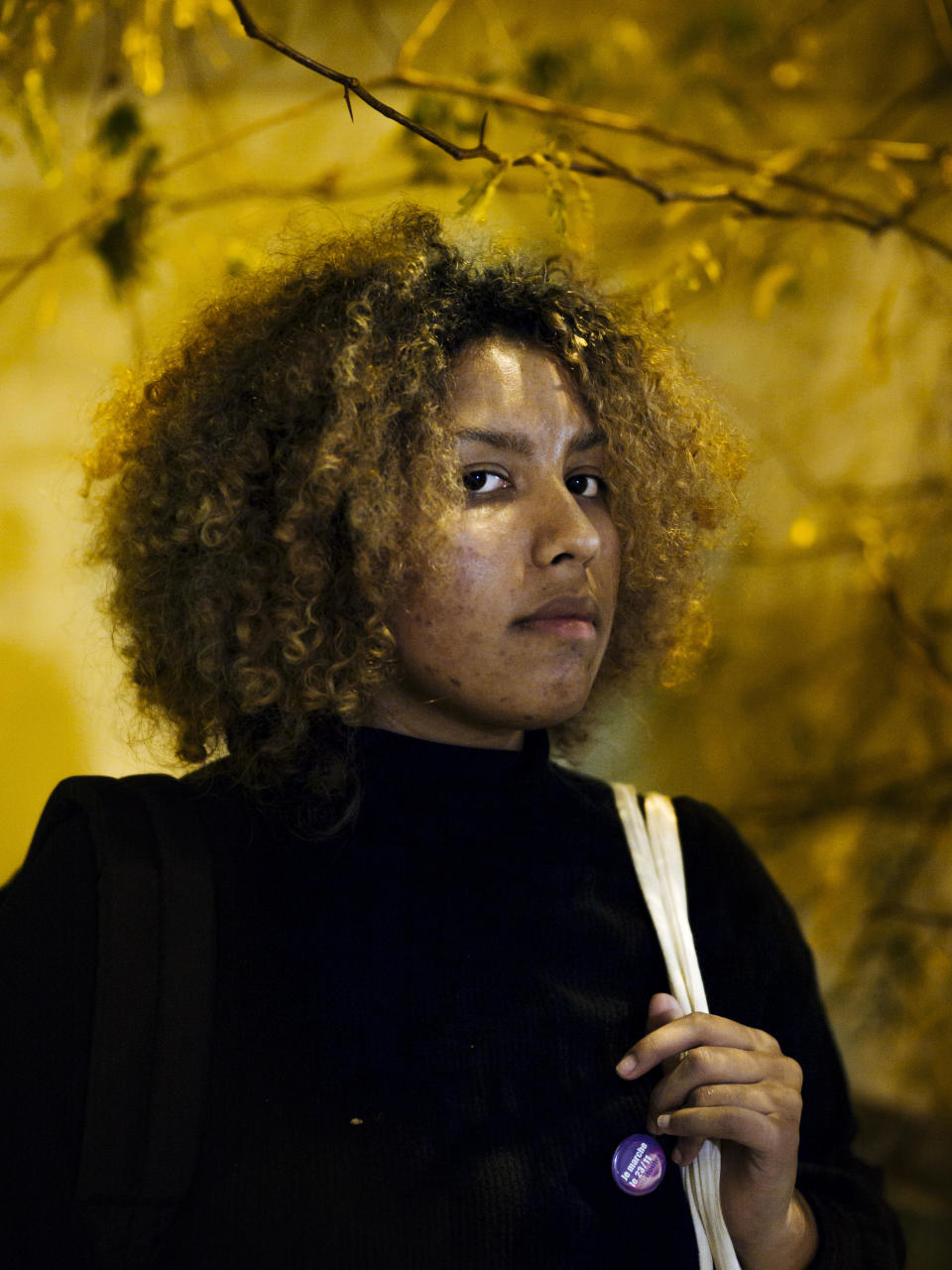 Maya, 19, a student in psychology from Versailles poses for a portrait in Paris. After living with domestic violence with her past boyfriend, Maya needed to find a way to give a meaning to her life. By pasting some slogans in the street, she found the strength not to be afraid anymore. (Photo: Kamil Zihnioglu/AP)