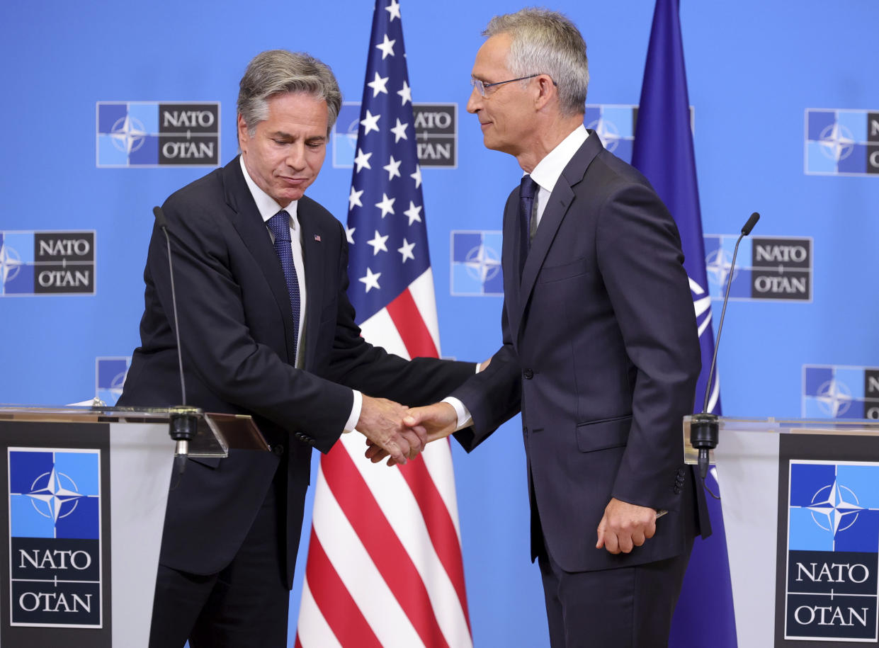US Secretary of State Antony Blinken, left, shakes hands with NATO Secretary General Jens Stoltenberg at the end of a media conference at NATO headquarters in Brussels, Friday, Sept. 9, 2022. (AP Photo/Olivier Matthys)