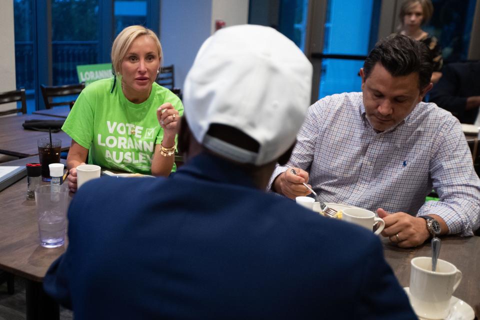 Senators Lauren Book, left, and Jason Pizzo speak with local Tallahasseean Stanley Sims during a campaign breakfast for Loranne Ausley on Wednesday, Oct. 26, 2022.