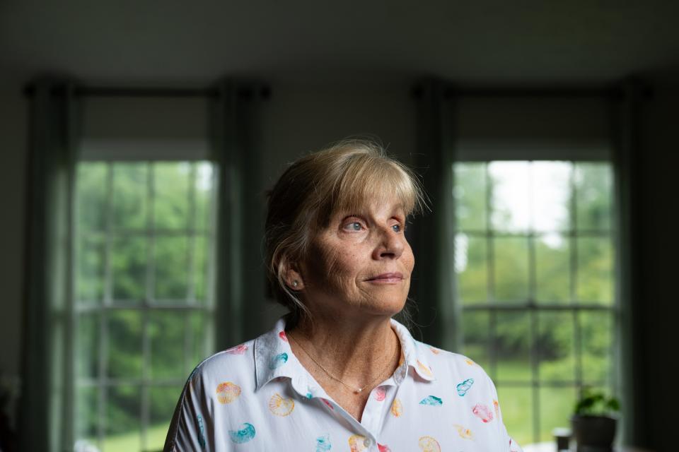 Jackie Duda, photographed in her home in New Market, Maryland, faces daunting dental bills after a life-threatening case of sepsis caused her teeth to decay.  Josh Morgan, USA TODAY