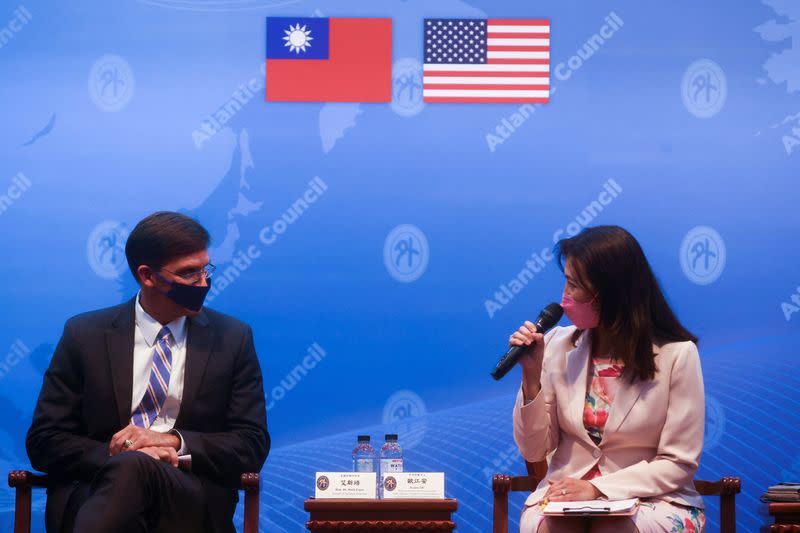 FILE PHOTO: Former U.S. Defense Secretary Mark Esper and Taiwan Foreign Ministry spokeswoman Joanne Ou attend a press conference in Taipei