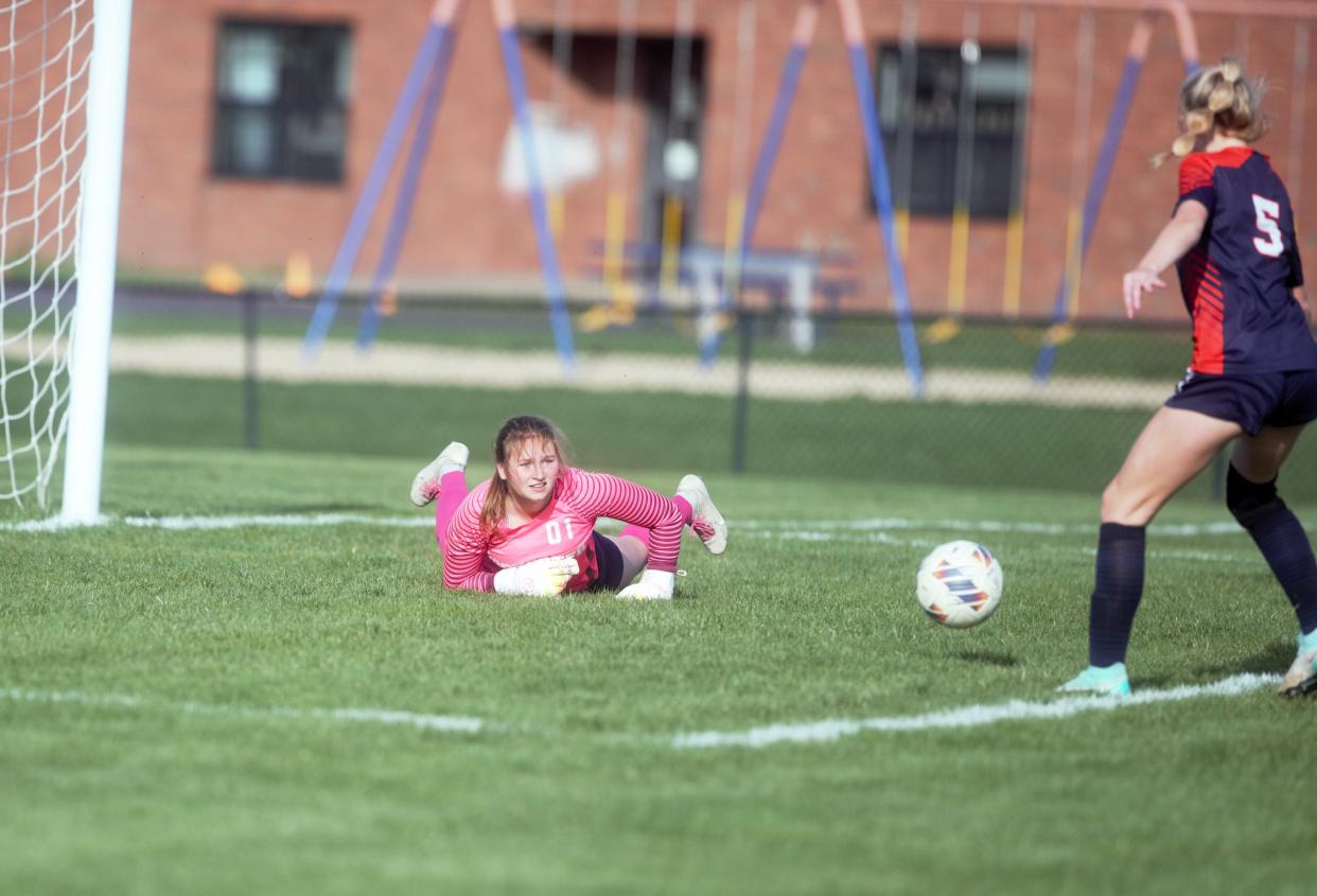 Rochester goalkeeper Alyse Day makes a diving save against Sacred Heart-Griffin during a Central State Eight Conference girls soccer match on Tuesday, April 9, 2024. SHG won 2-0.