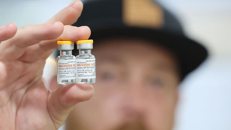 Riley Drage, a Utah Naloxone trainer, holds a naloxone vial prior to training for opioid overdose in Salt Lake City on Tuesday, May 23, 2023.