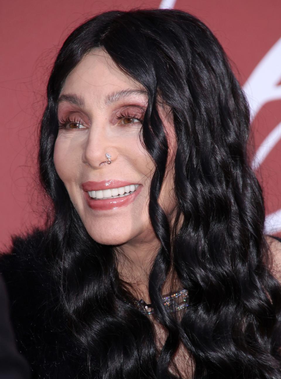 <h1 class="title">Cher smiling</h1><cite class="credit">Getty Images</cite>