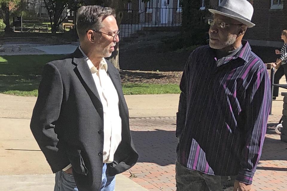 Terry Harrington, right, speaks with attorney Tom Frerichs on the Coe College campus in Cedar Rapids, Iowa, on Tuesday, Oct. 8, 2019. Harrington, who spent more than 25 years in an Iowa prison for a 1977 murder he did not commit, shared his experience with students on Tuesday, in his first public comments in years. (AP Photo/John Foley)