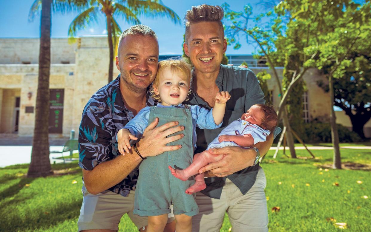  Ian Greenway holding son Wilder, while Jonathan Kirkby holds baby Aster in Miami - Saul Martinez