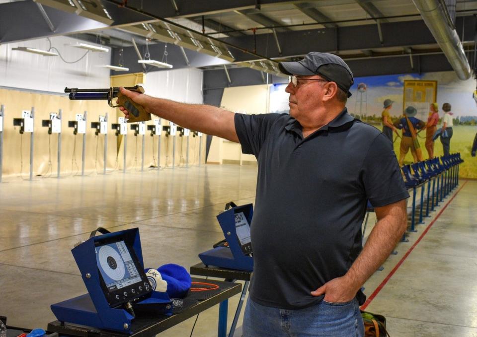 Larry Kiraly of Perrysburg practices air pistol at the Gary Anderson CMP Competition Center on Tuesday.